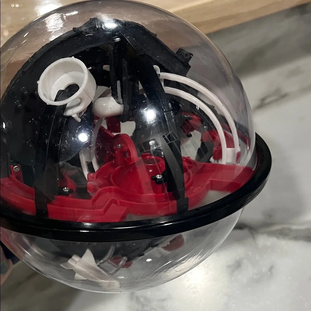 Perplexus Ball puzzle Interactive Red and Black Puzzle Sphere sharper‎ image